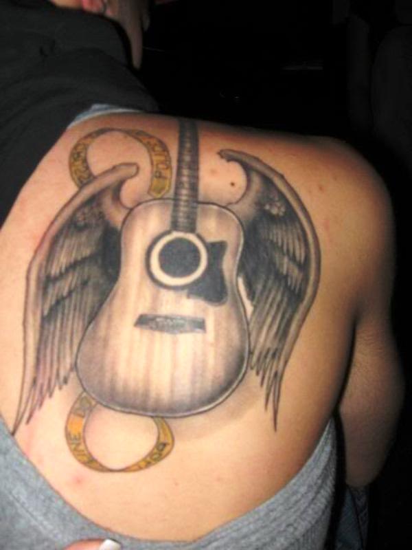 33 Best Guitar Back Tattoo Pics